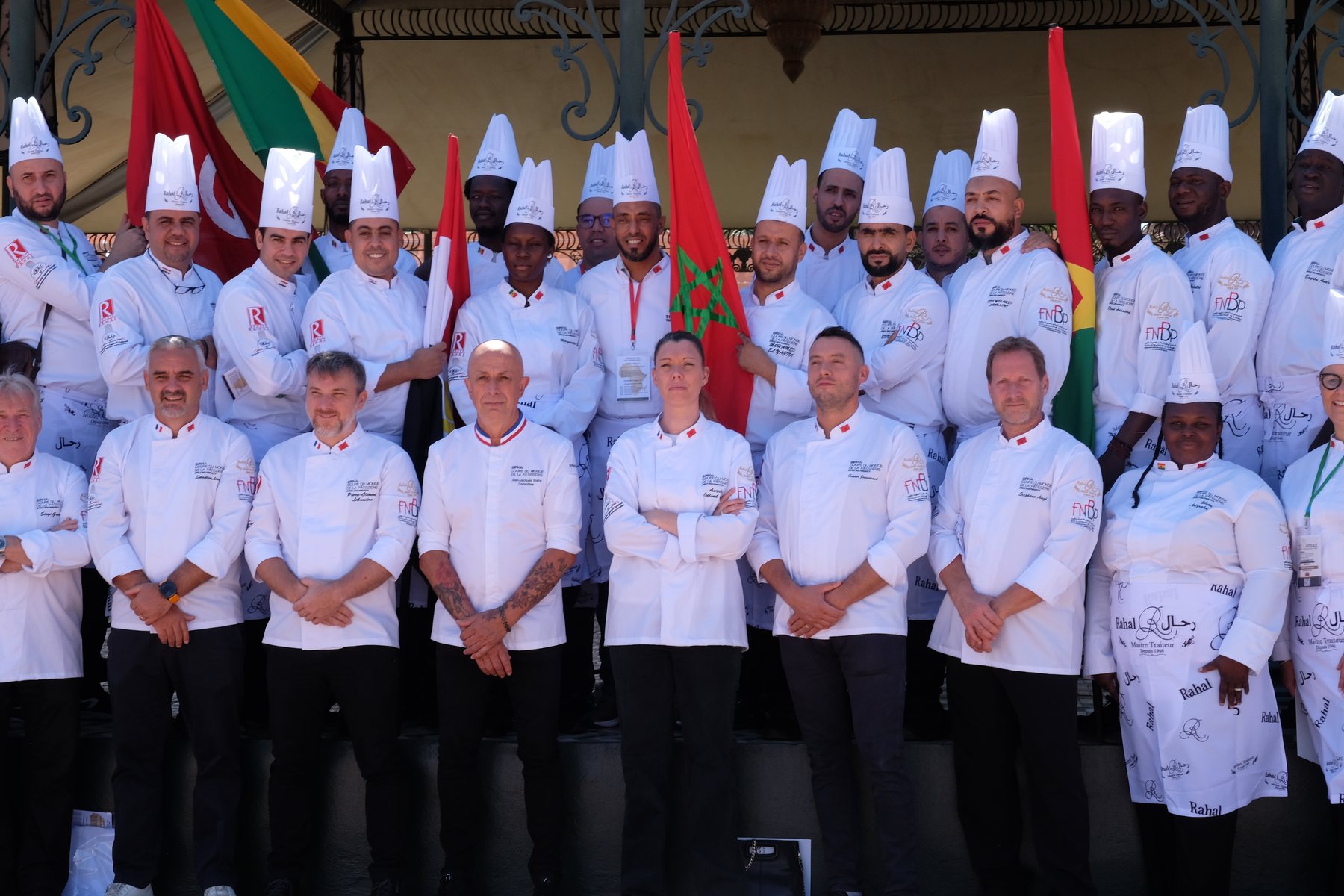 Chefs from several African delegations gathered beneath their flags, TOC Afrique 2024, Marrakech